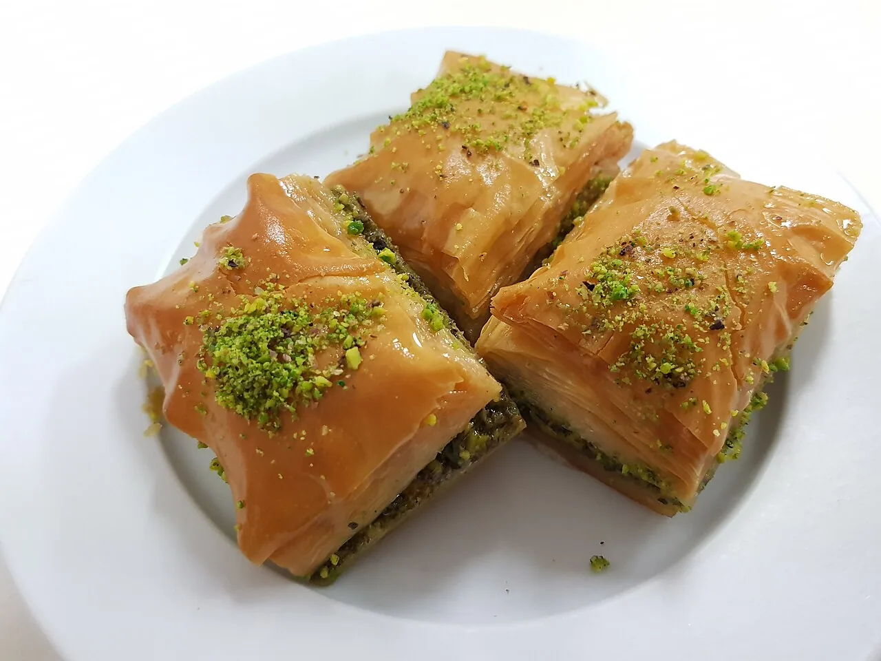 Turkish baklava pastries with chopped nuts and syrup