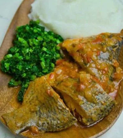 Muriwo greens served with sadza and fish, Zimbabwe