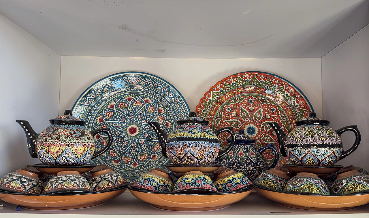 Patterned ceramic teapots, bowls, and plates at Chorsu Bazaar, Tashkent, Uzbekistan