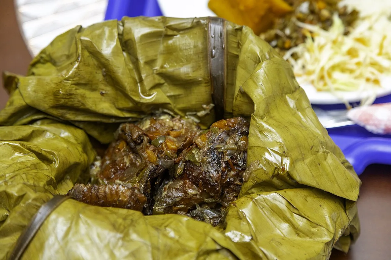 Close view of chicken luwombo cooked in a banana leaf, Uganda