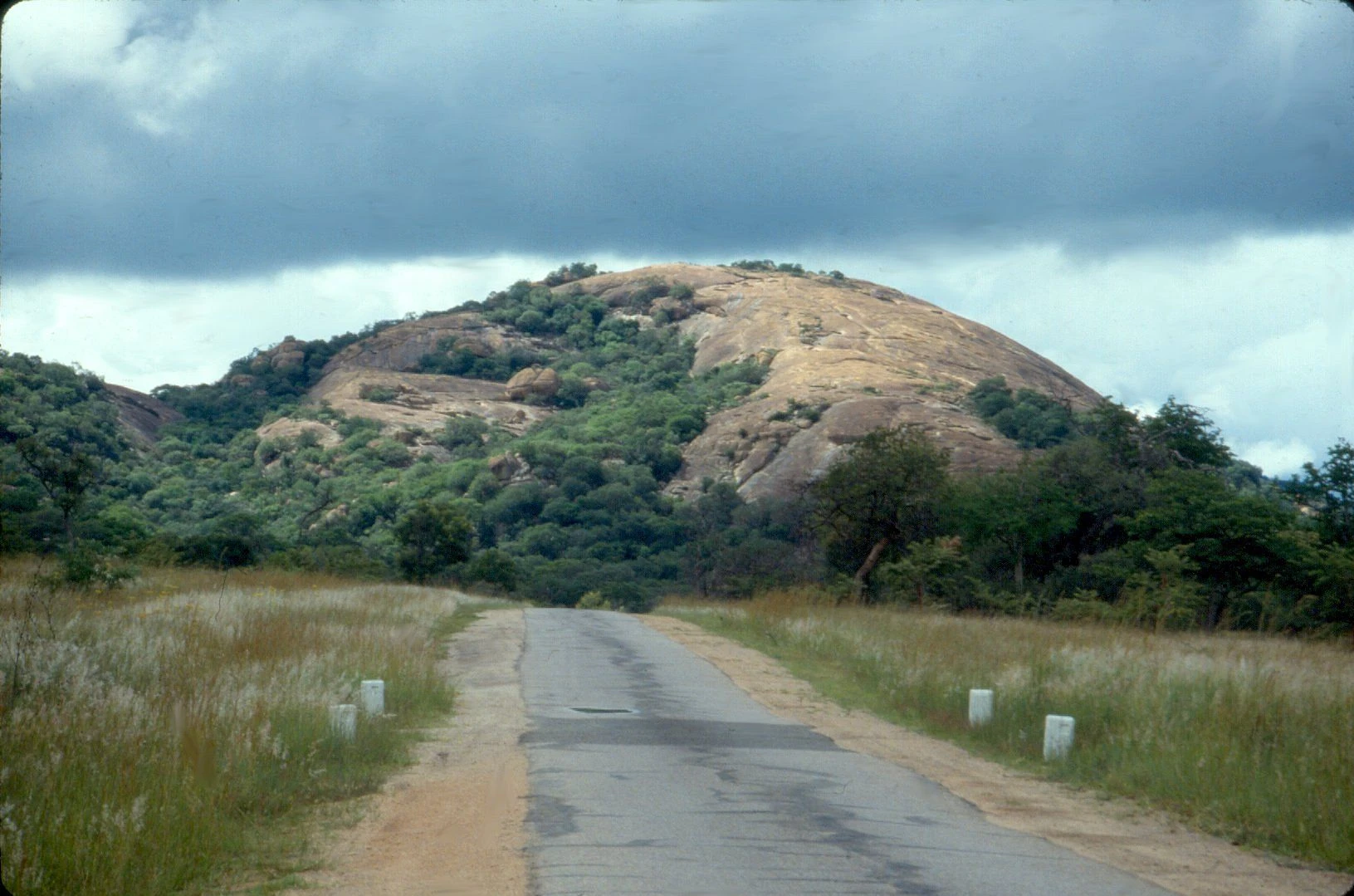 A road beside a granite kopje in the Matobo Hills, Zimbabwe