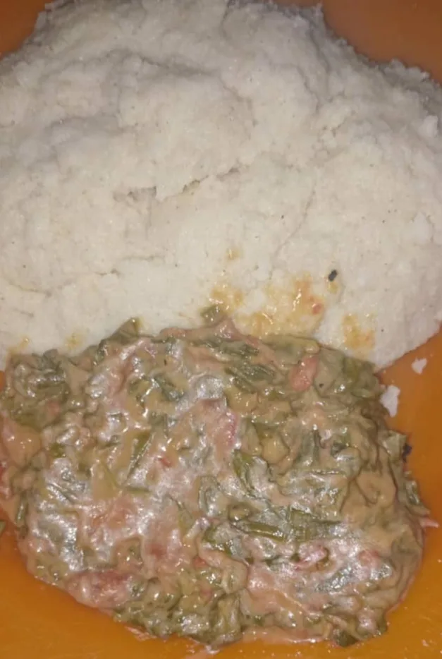 Tsunga greens in dovi peanut sauce served with white sadza, Zimbabwe
